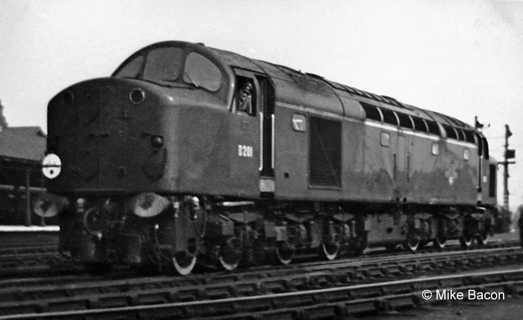 English Electric Type 4 diesel-electric locomotive No. D201 was 'nearly new' when Mike saw it in the loco yard at Grantham. D201 entered service with British Railways at Stratford shed early in April 1958. The following month it transferred to Hornsey on the East Coast Main Line, when it was more likely to be seen at Grantham. The arrival of these locomotives heralded the end of steam power between King's Cross and the North, though problems with their reliability kept the fleet of steam locos rostered to some of the most prestigious express services until the arrival of the Deltics in 1961. Photograph by Mike Bacon.