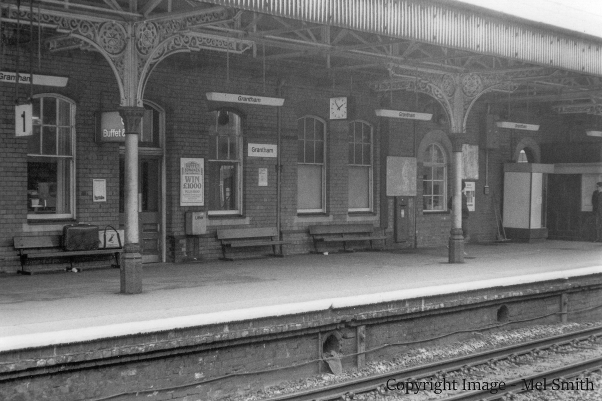 This view shows the windows to the former Dining Room (central) and a further window just beyond the post box. This single window we think was originally an additional entrance to the platform from the Booking Hall. The only entrance in use at the time of this photograph can just be seen behind the Ticket Booth on the right. Copyright Image - Mel Smith