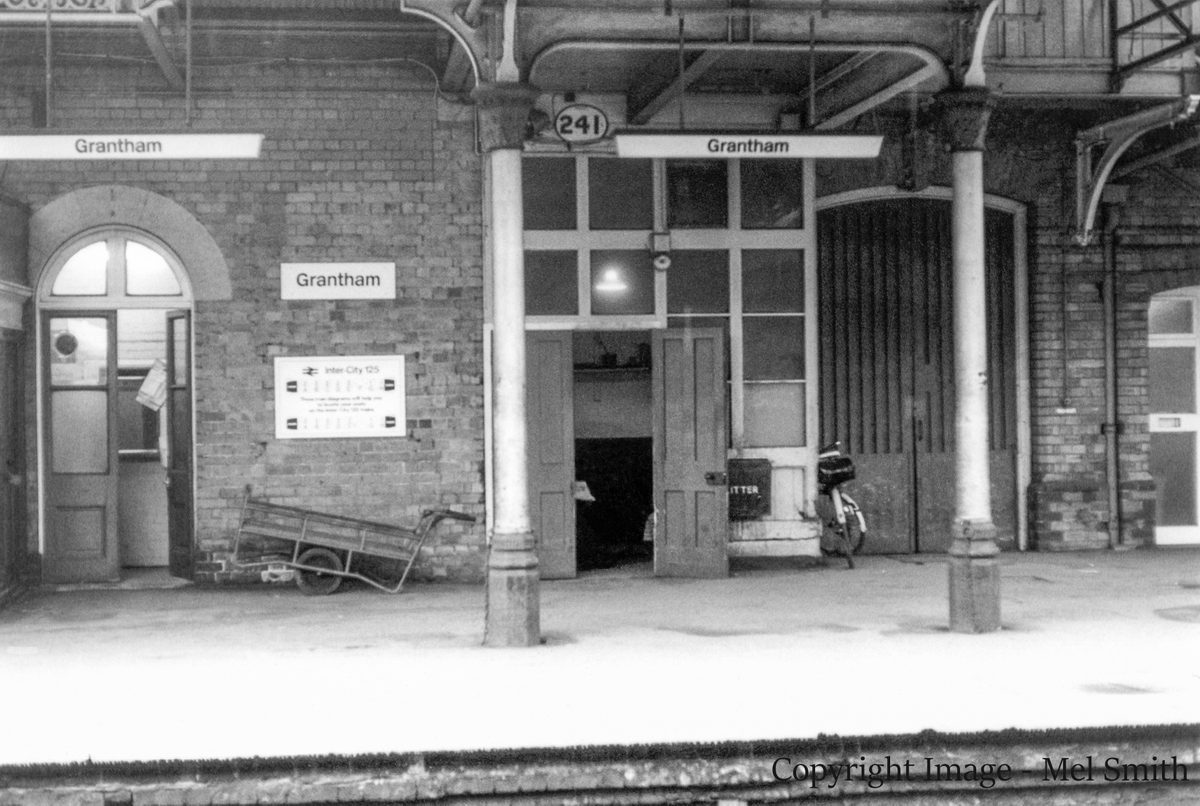 The end of the Book Stall is just in view on the left. The open doors (centre) were to the "Postal Authorities Room" The larger double doors behind the bicycle was the Luggage Entrance" The doors just coming into view on the right lead through to "Enquiries" with another room behind this for use by "Station Masters Clerks" Copyright Image - Mel Smith
