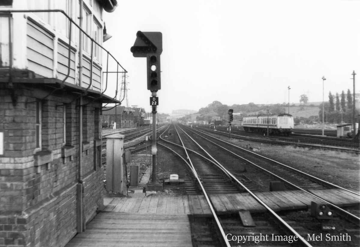 We are now stood at the end of platform 1 looking south. On the left is Grantham signal box (formerly 'Yard Box'). The colour light signal controls the "up fast" to "up slow" turnout just beyond. The slow line continued for 5 miles to High Dyke, enabling slower traffic to be overtaken by expresses. Copyright Image - Mel Smith