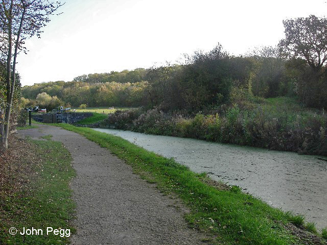 Here is where the Denton Branch used to cross the Grantham Canal on an angle, from hard on our left to the gap in the bushes on the far side. There's another lock on the canal in the distance, showing that the land continues to ascend gradually. We are 2½ miles from Belvoir Junction here.