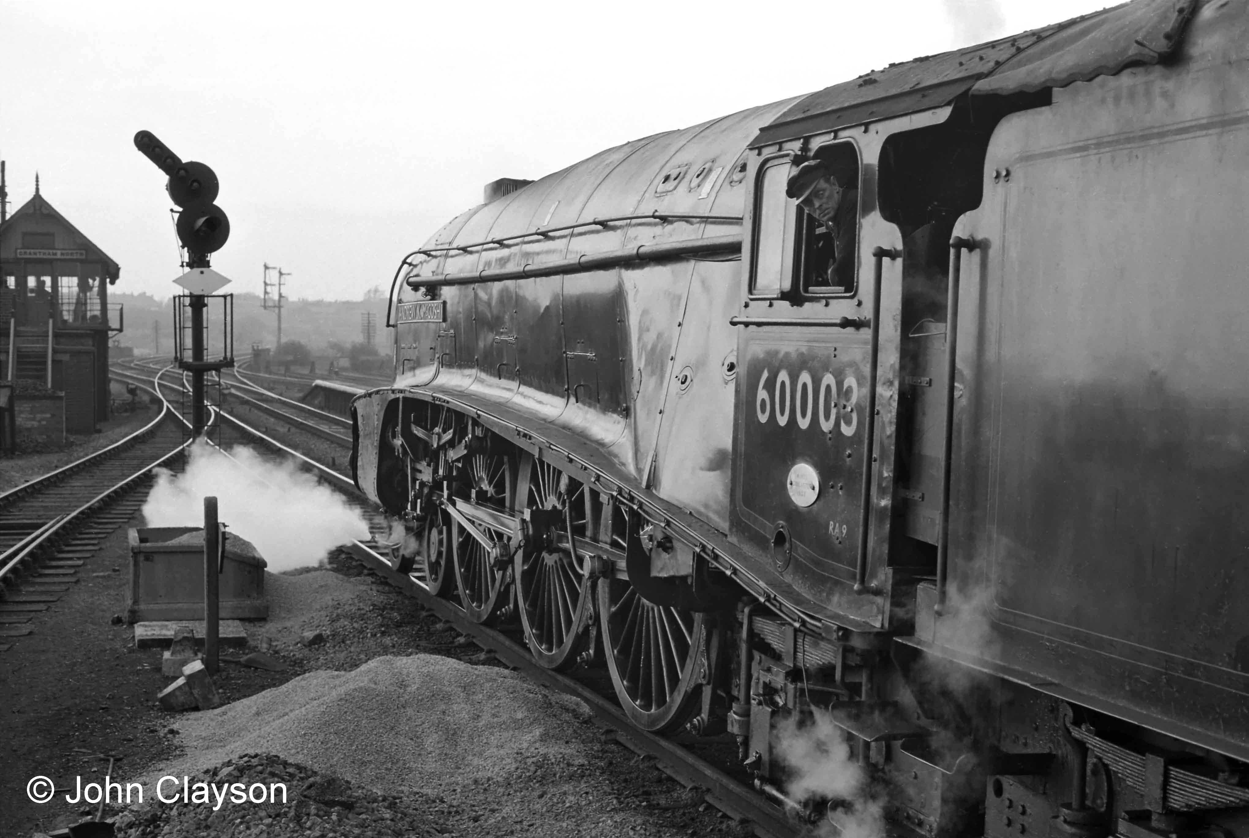 Looking north from the end of platform 3 (now platform 2) on 25th May 1962, Grantham North box is on the left. The colour light signal controls the junction with the line to Nottingham which is just beyond the box. Photograph by Cedric A. Clayson.