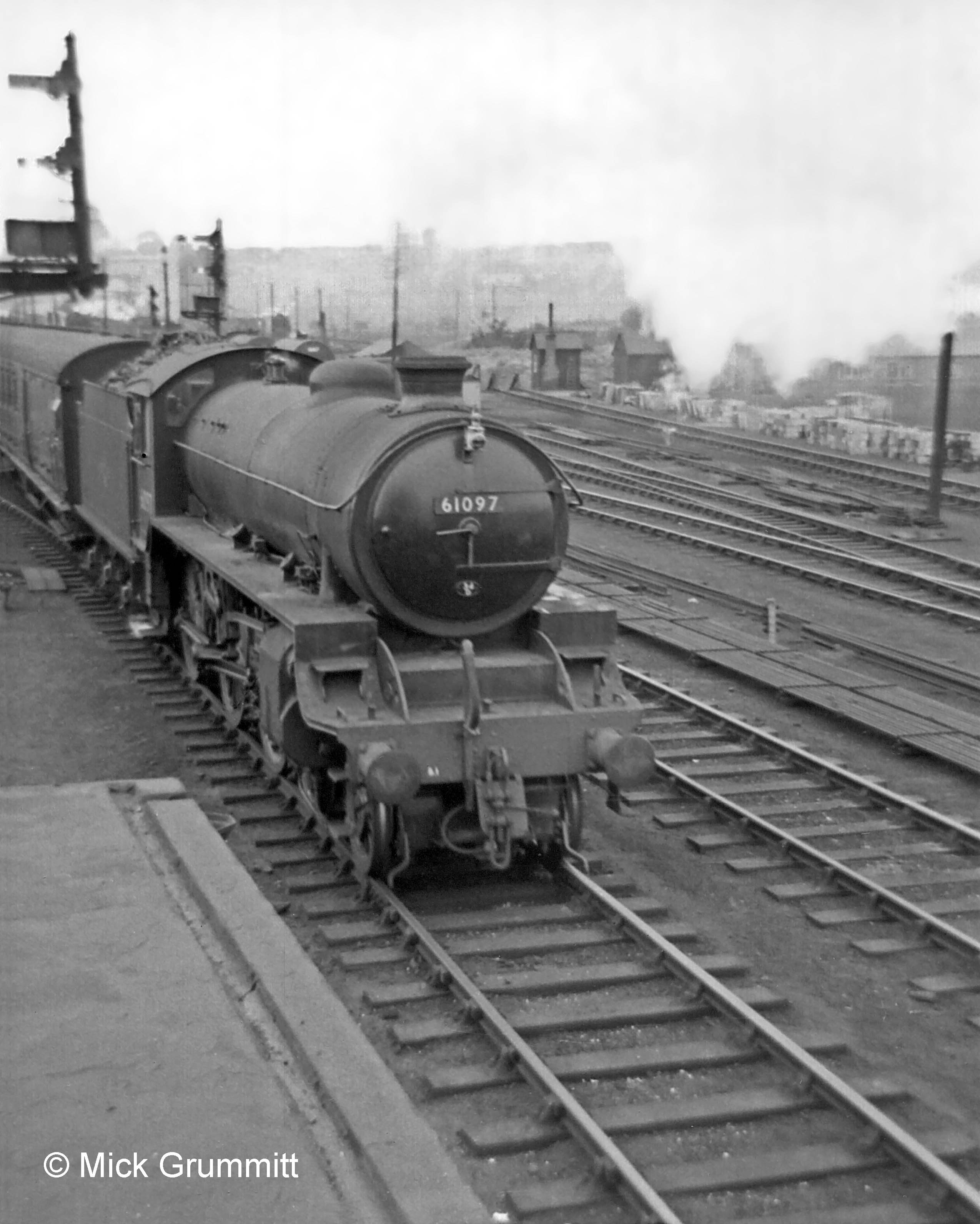 A B1 locomotive leaves the Western platform with the 11.57am all stations to Nottingham Victoria and Derby Friargate, passing to the west of the box. At bottom left is the flat roof of the relay room. Photograph by Mick Grummitt.