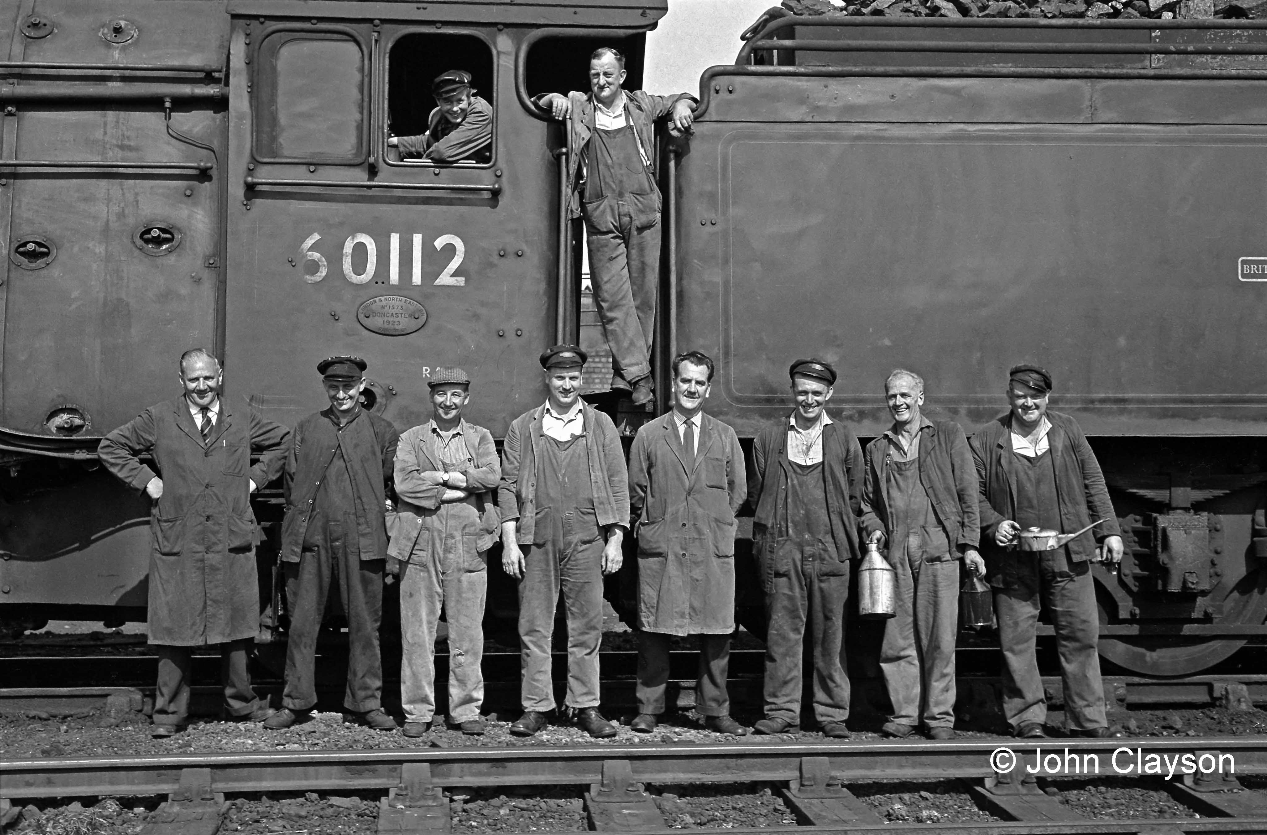 Albert Bellamy was Grantham's shed foreman in August 1963. He is standing on the left of this group of shed staff and footplate crew. Photograph by Cedric A. Clayson.