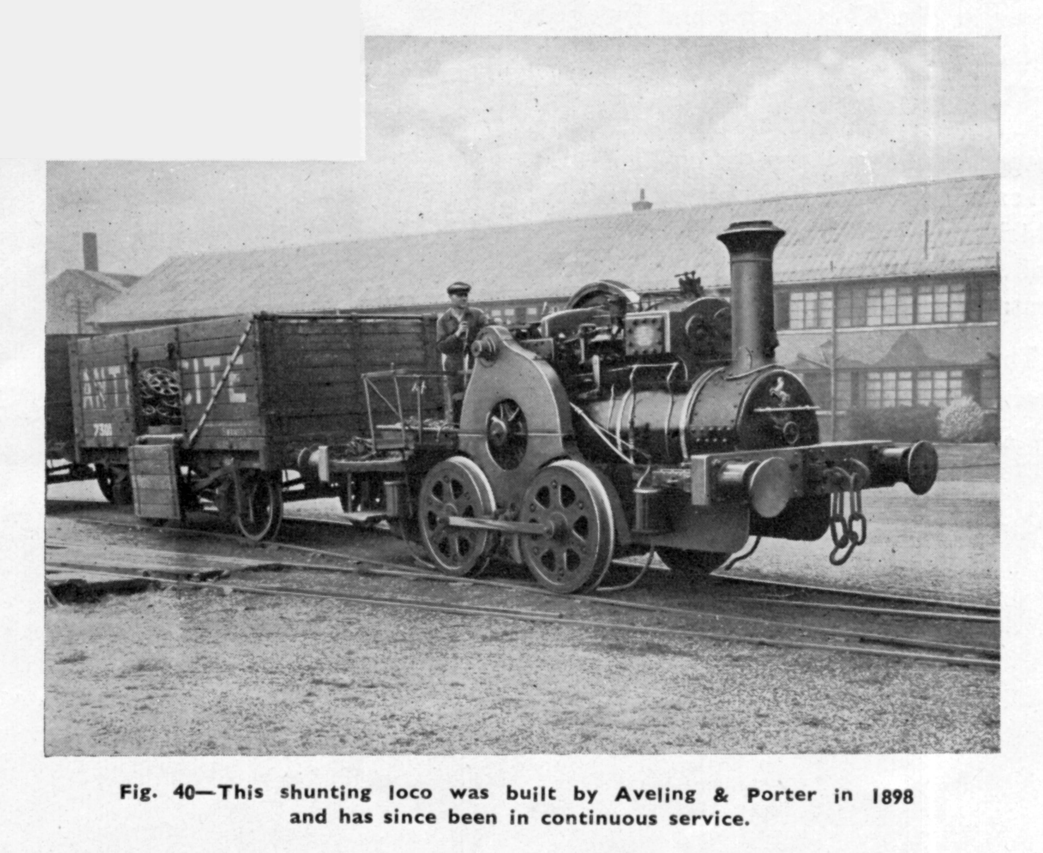 The Aveling-Barford 'tramway' shunting locomotive in the works sidings at Grantham. The wheels were powered by a gear drive, shielded by the cover just in front of the driver. While this engine may appear insignificant beside the express and main line locomotives of the adjacent LNER it had an advanced technical feature which few of them shared. It was a 'compound' engine having separate high pressure and low pressure cylinders, seen mounted above the boiler just behind the rather elaborate chimney. The only compound engine seen on the main line at Grantham at this time was the unique Class W1 locomotive No. 10000. From page 11 of a booklet The Works and Products of Aveling-Barford Ltd. Grantham reprinted from British Machine Tool Engineering, July-August-September 1942 issue. Discovery Museum Newcastle ref SE 7558.