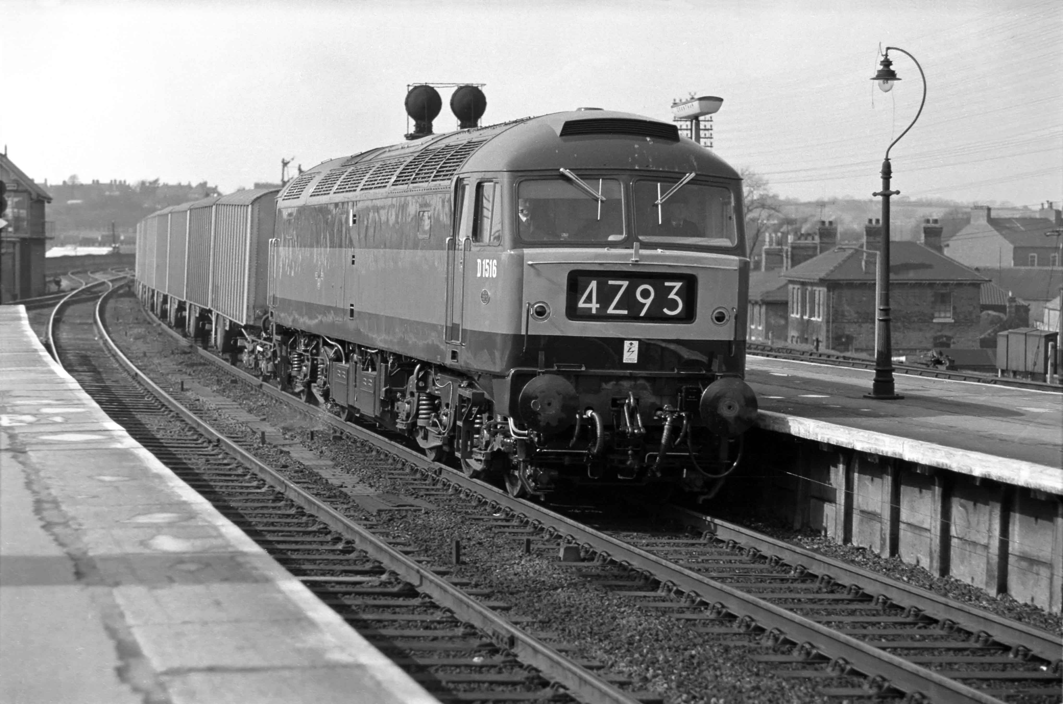 This southbound Class 4 express freight is headed by Brush Type 4 locomotive No. D1516 on 18th April 1963. The locomotive was practically brand new when this picture was taken, having entered traffic on 10th April. It was one of the pilot order for 20 locomotives (D1500 to D1519) of a class of which eventually more than 500 examples were built. Amazingly D1516 still exists, being preserved at the Midland Railway Centre, Butterley in Derbyshire by The 47401 Project / 47401 Diesel Locomotive Ltd. (see http://www.47401project.co.uk/). Photograph by Cedric A. Clayson, © John Clayson