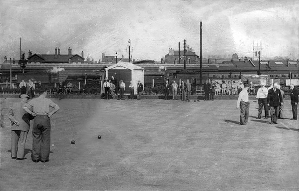 A game of bowls in progress with the locomotive yard and station beyond. Photograph from the Grantham Matters website.