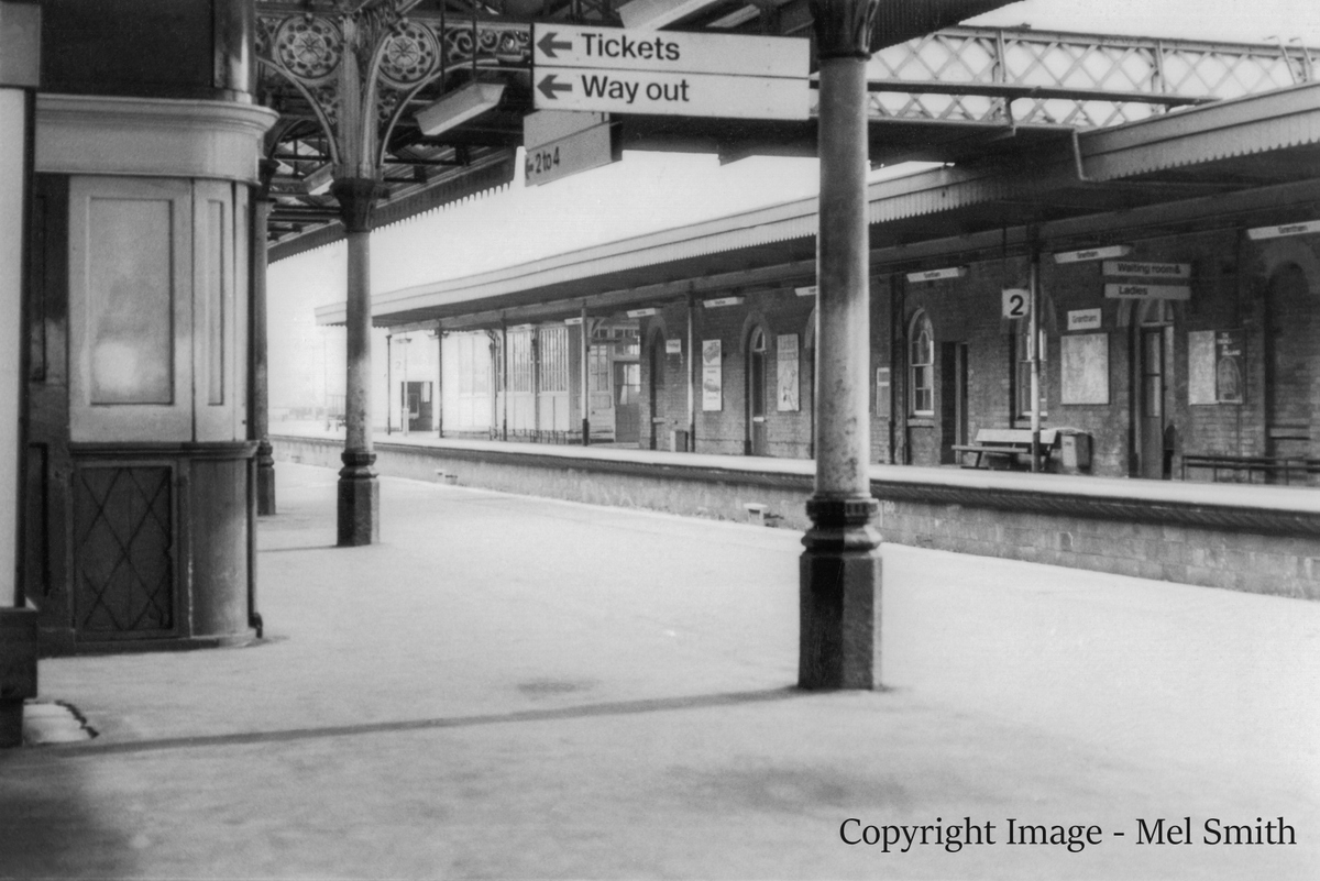 A view across the tracks from Platform 1 showing the buildings at the south end of the station on Platform 2 with the book stall on the left. Copyright Image - Mel Smith