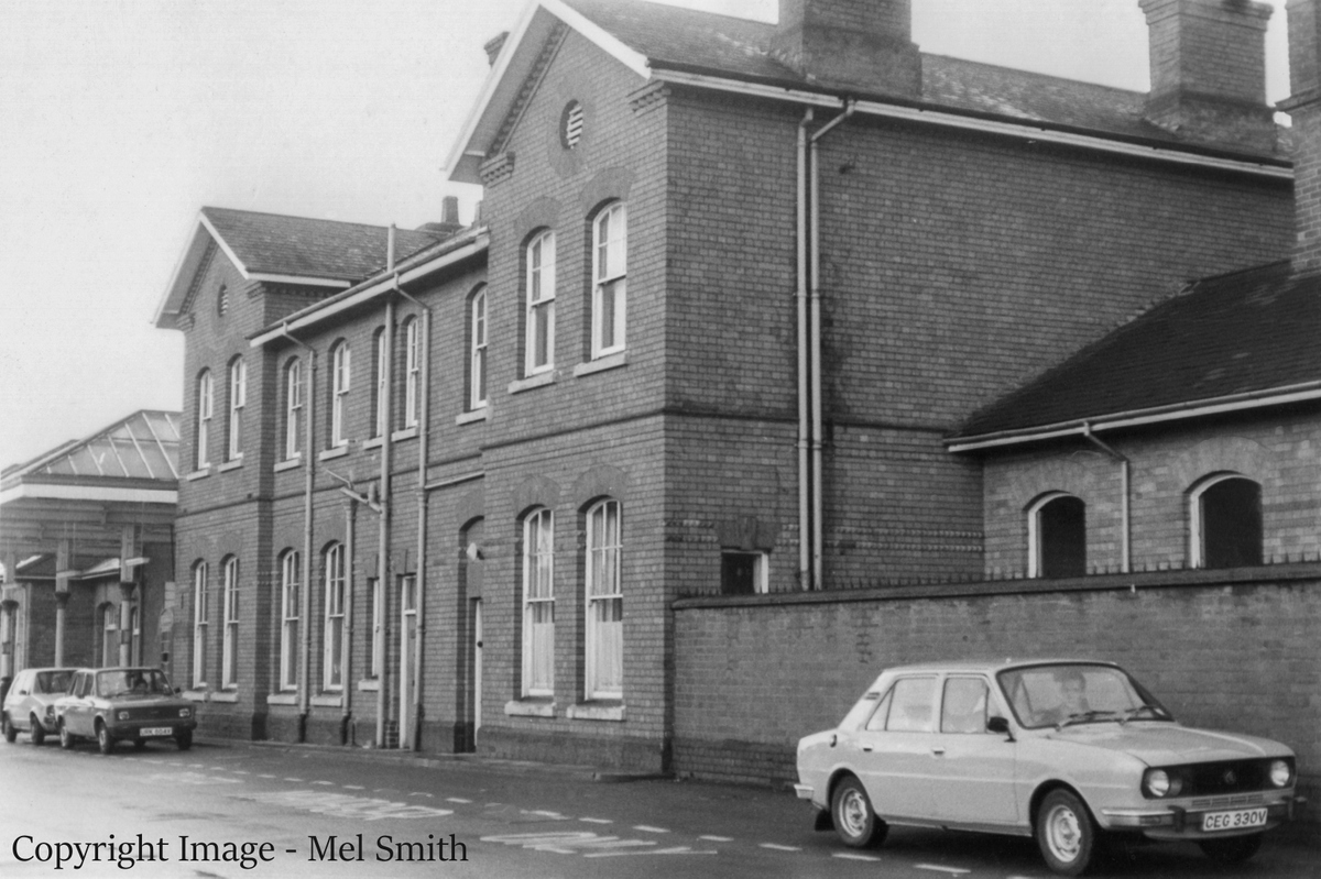 We now approach the main central block of the station buildings. The ground floor was once entirely given over to a Refreshment Room and a Dining Room along with their kitchen. The first floor, known as 'Station House', was living accommodation for some of the staff of those catering facilities. By the 1980s catering provision for passengers was much reduced and some spaces had become offices and stores. Copyright Image - Mel Smith